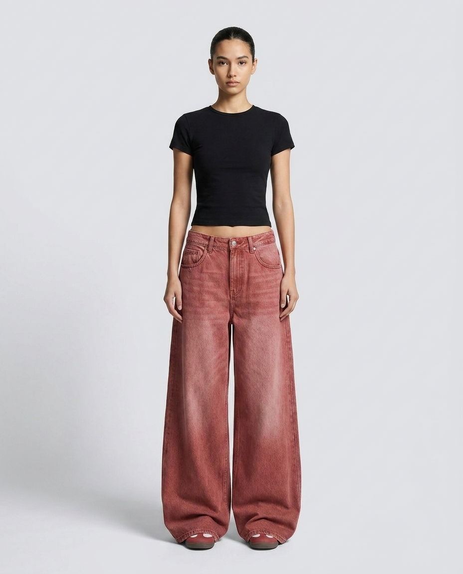 Baggy Jeans for Women — Women's low rise baggy jeans in faded red on model — wide leg pooling over shoes
