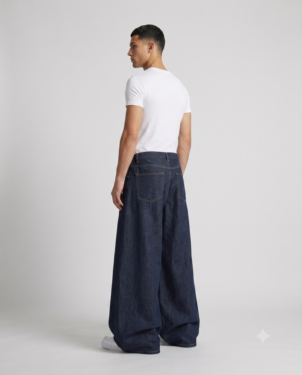 Cooper Jeans — Night Wash on model — three-quarter view