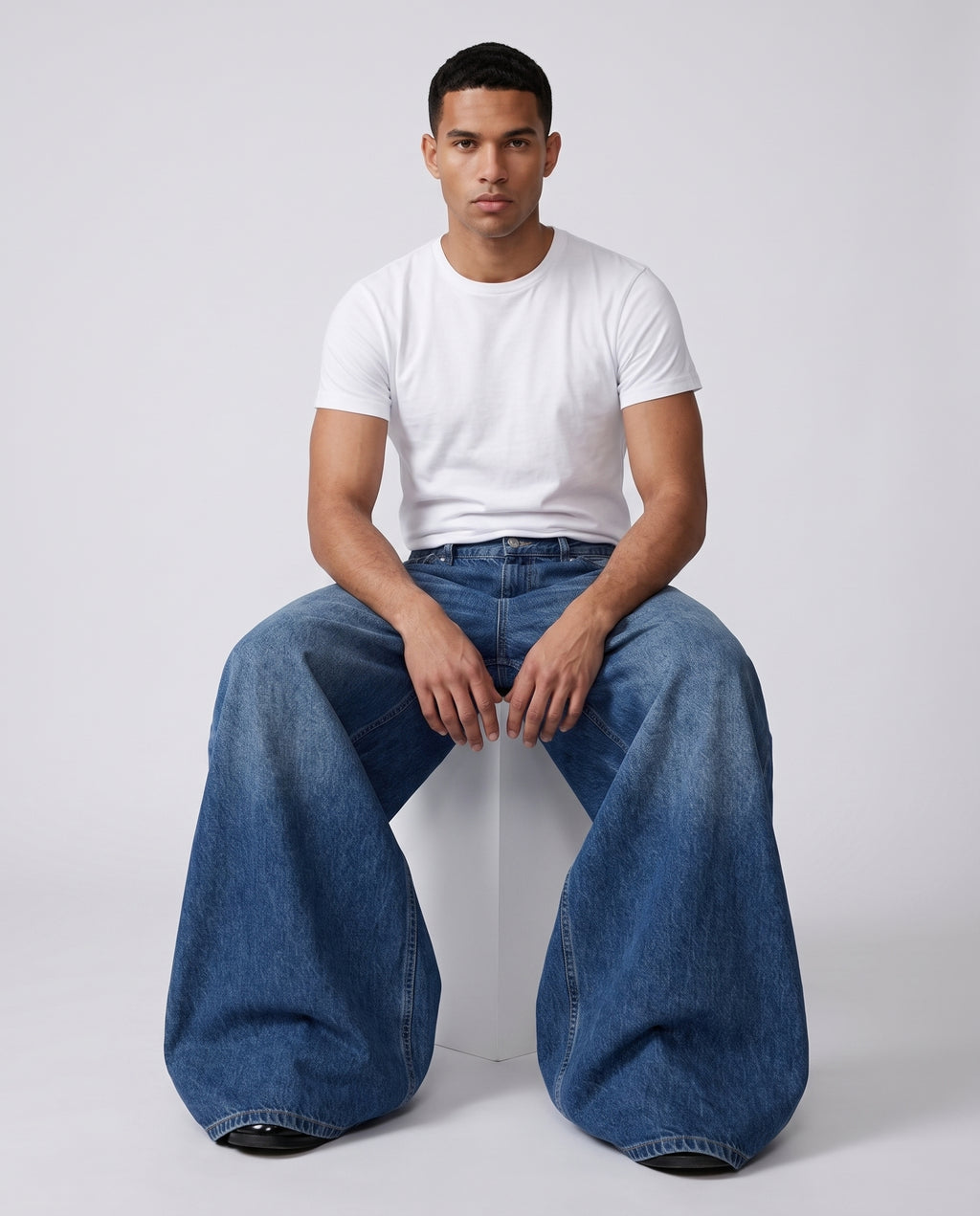Maxout Jeans Rivet Blue on model — seated fit view