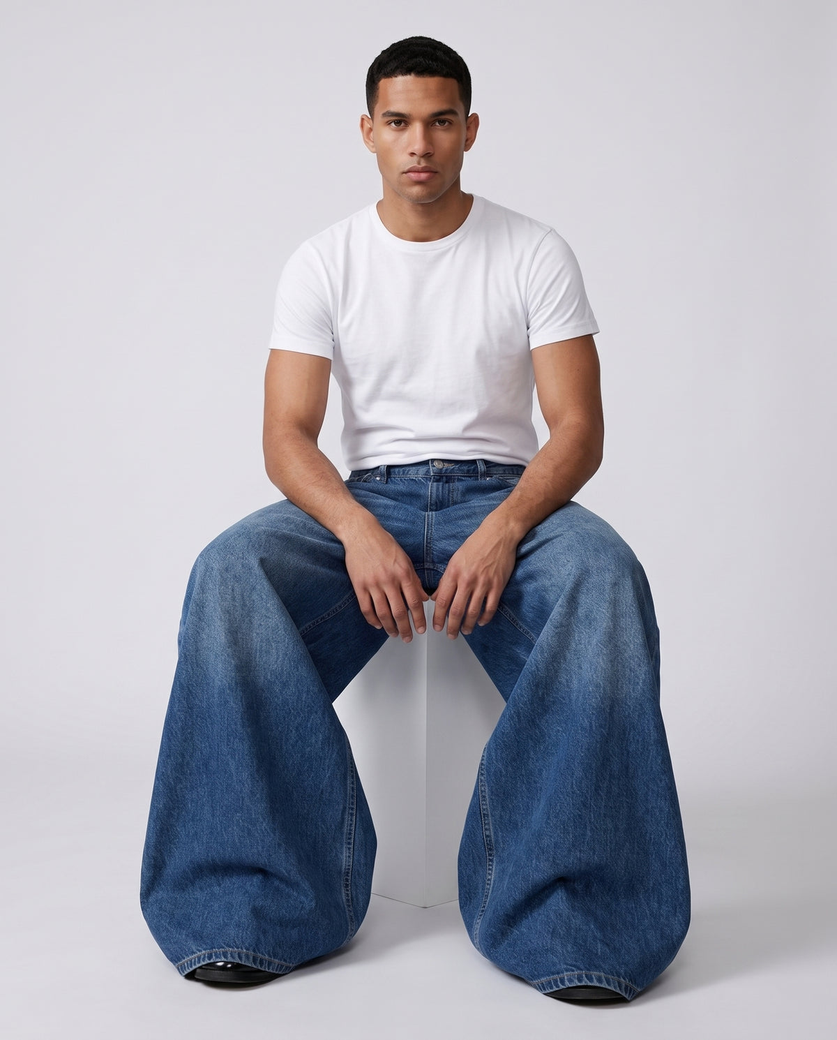 Maxout Jeans Rivet Blue on model — seated fit view