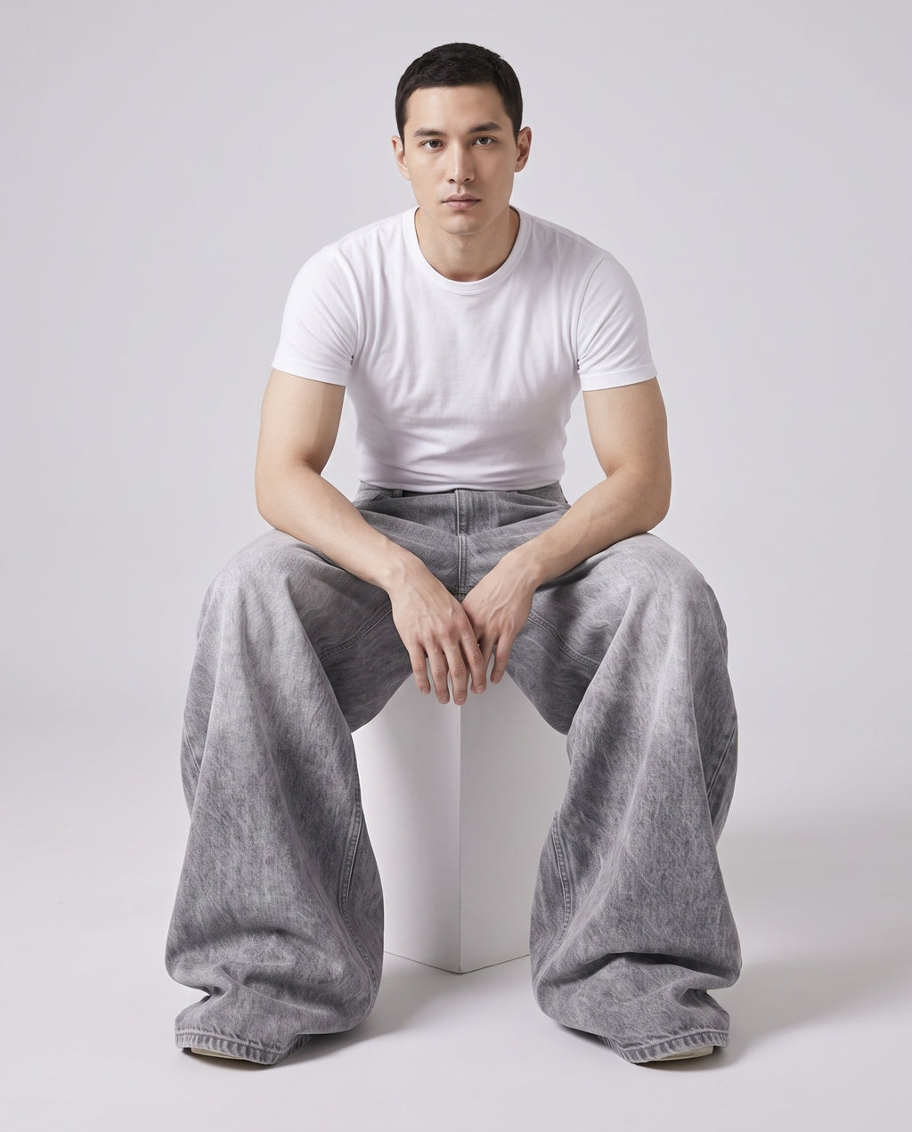 Maxout Jeans Polar White on model — seated fit view