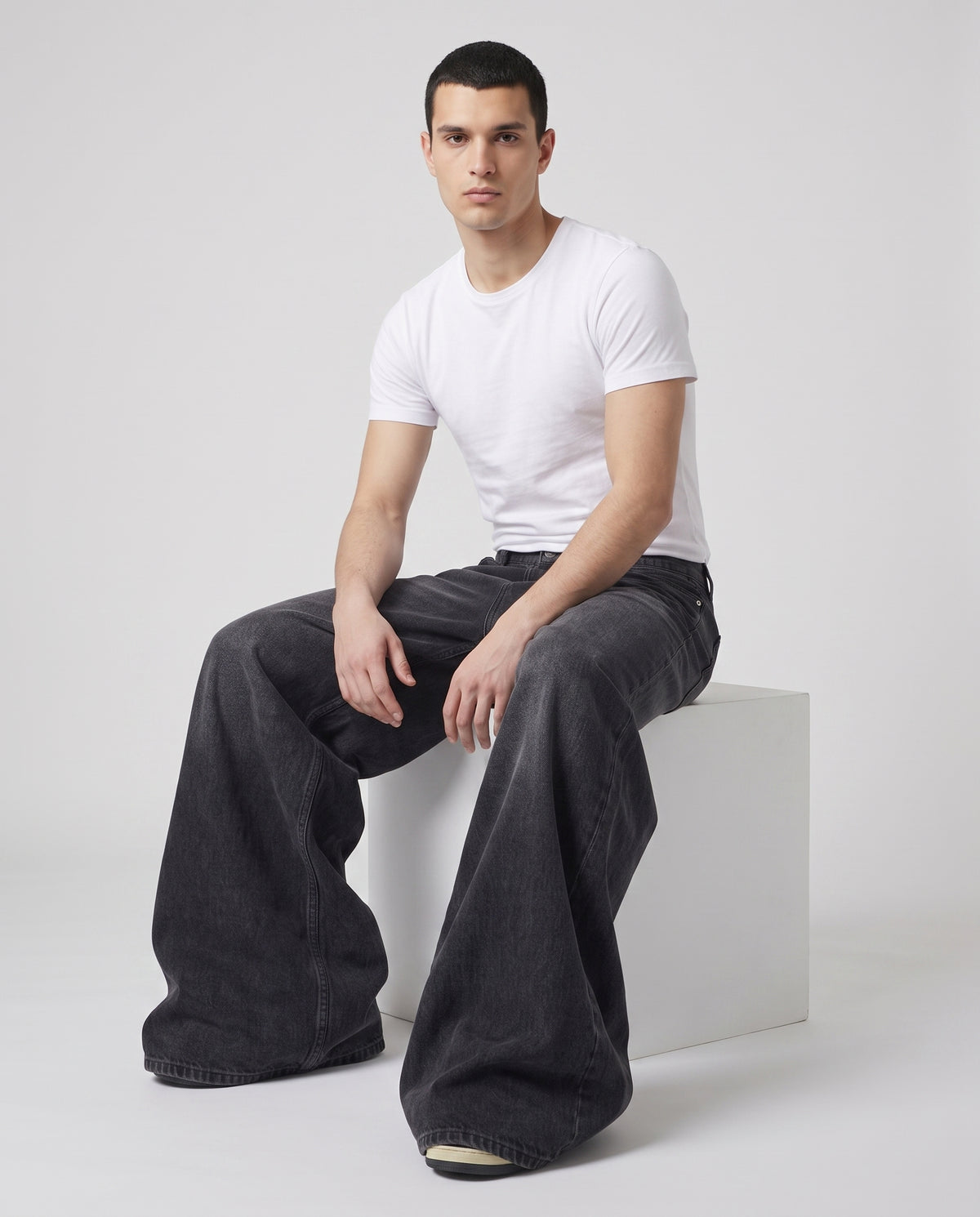 Easy Jeans — Soft Black on model — seated fit view