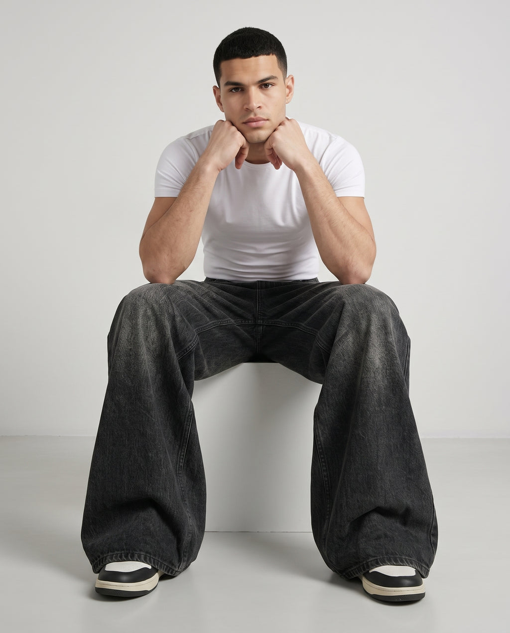 Session Jeans — Graffiti Black on model — seated fit view