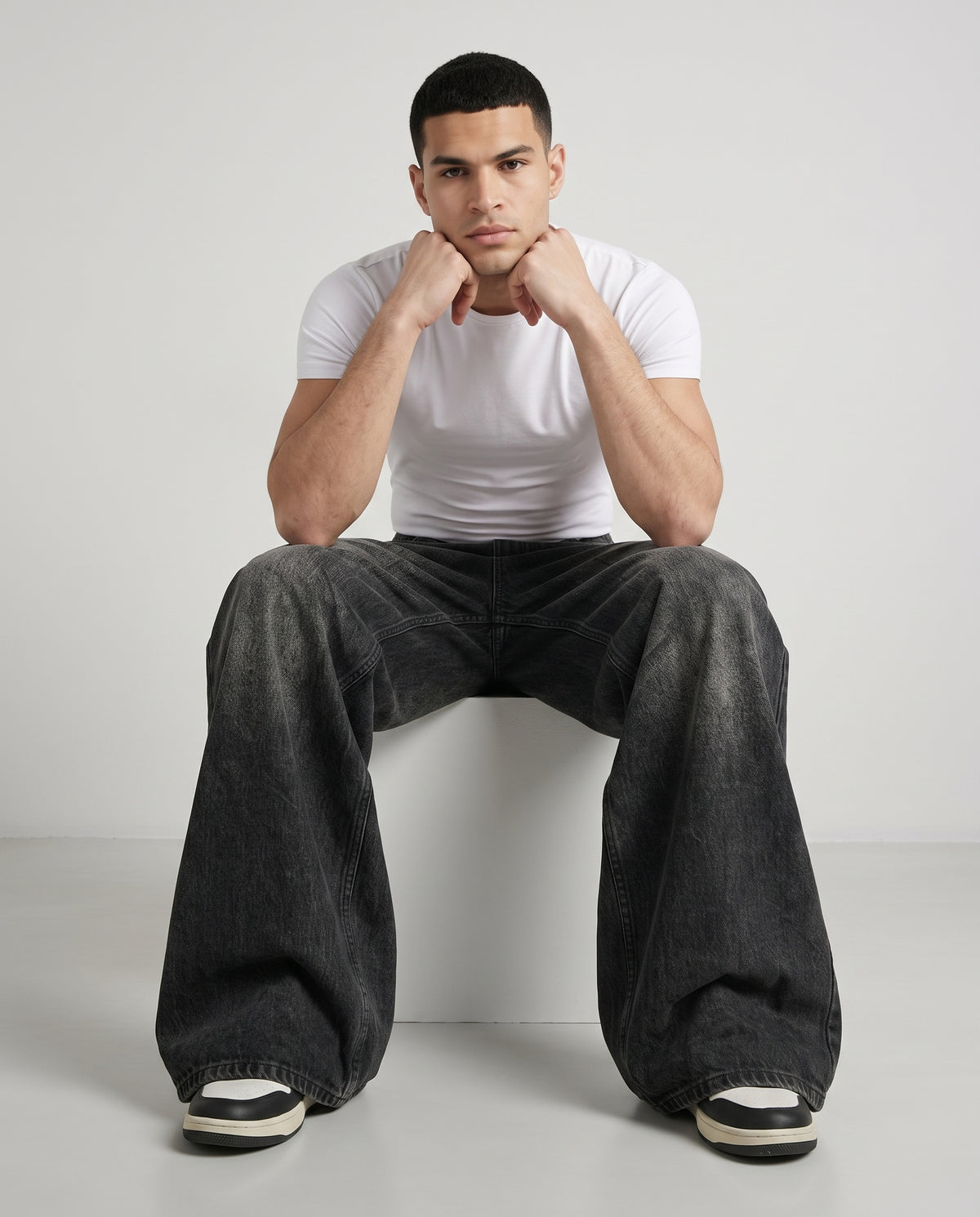 Session Jeans — Graffiti Black on model — seated fit view