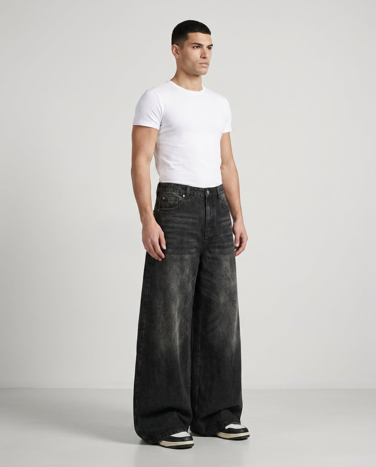 Session Jeans — Graffiti Black on model — three-quarter view