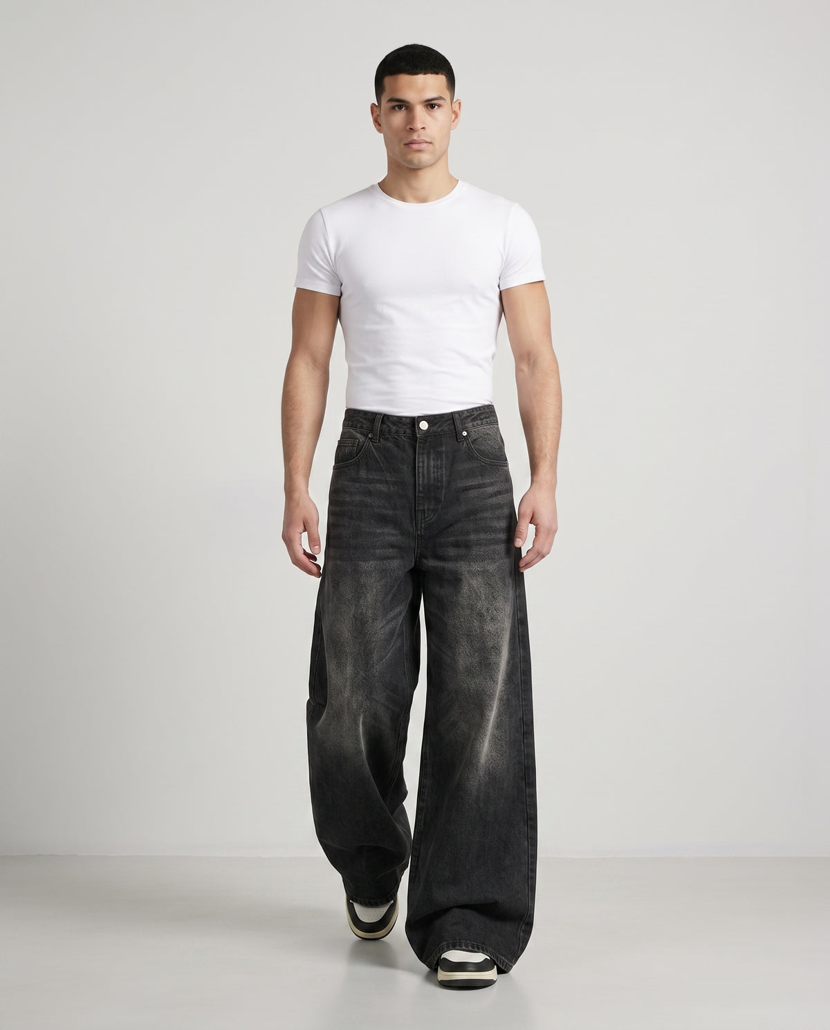 Session Jeans — Graffiti Black on model — walking, fabric in motion