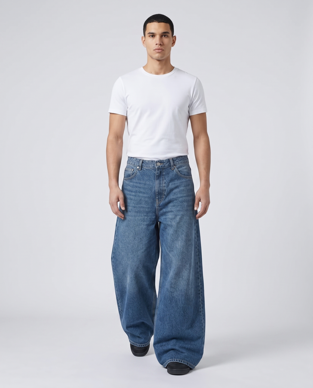 Maxout Jeans — Stonewash on model — walking, fabric in motion