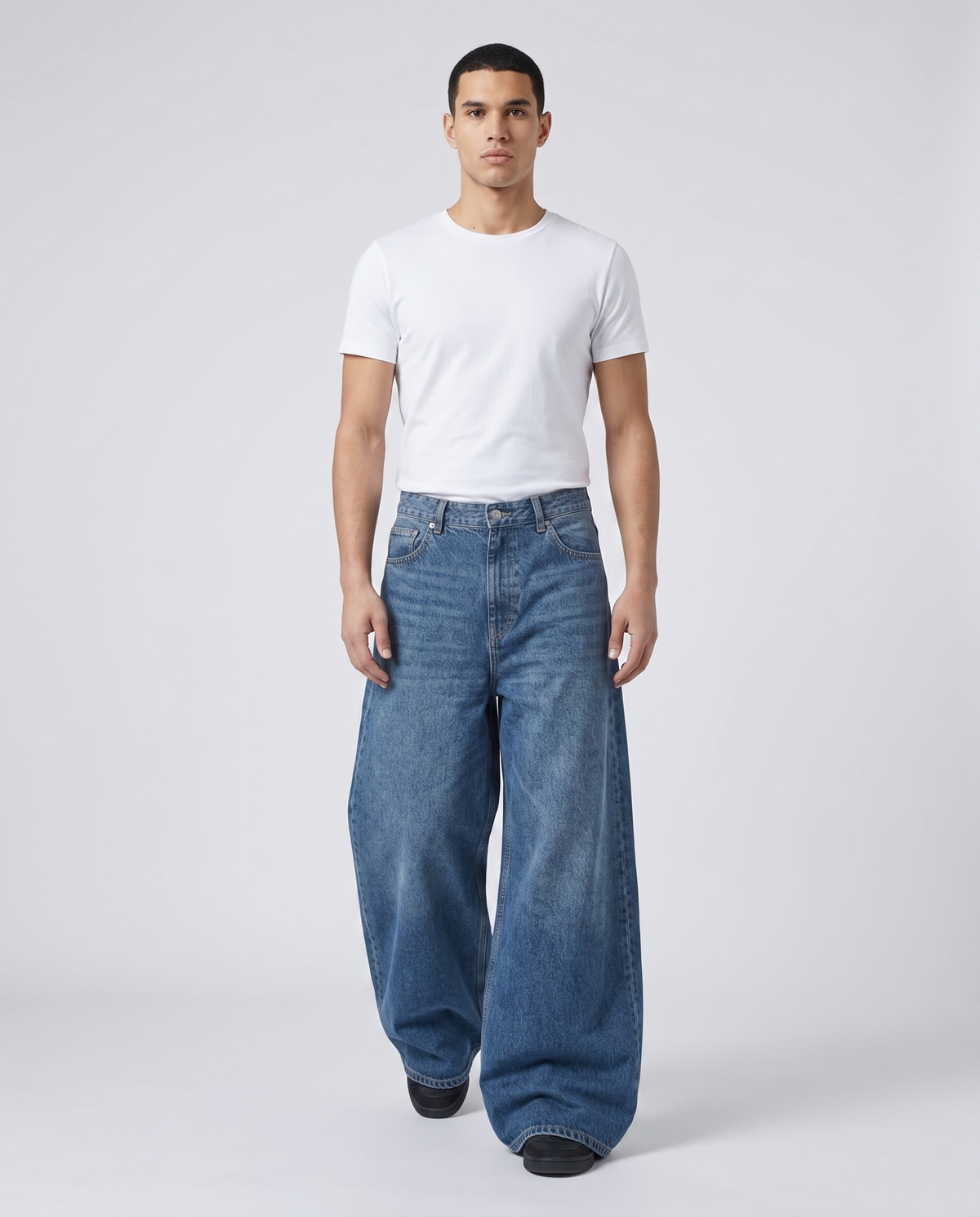 Maxout Jeans — Stonewash on model — walking, fabric in motion