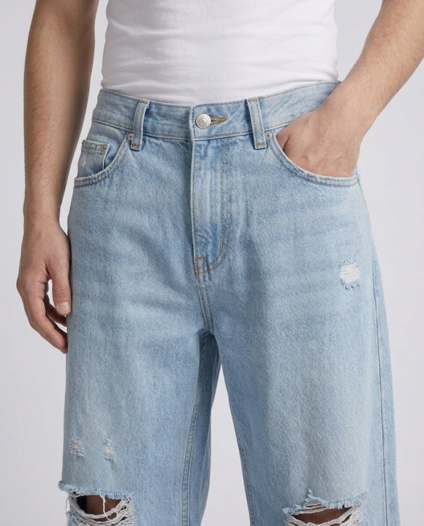 Boulevard Distressed Jeans — Ice Blue on model — waist and pocket detail