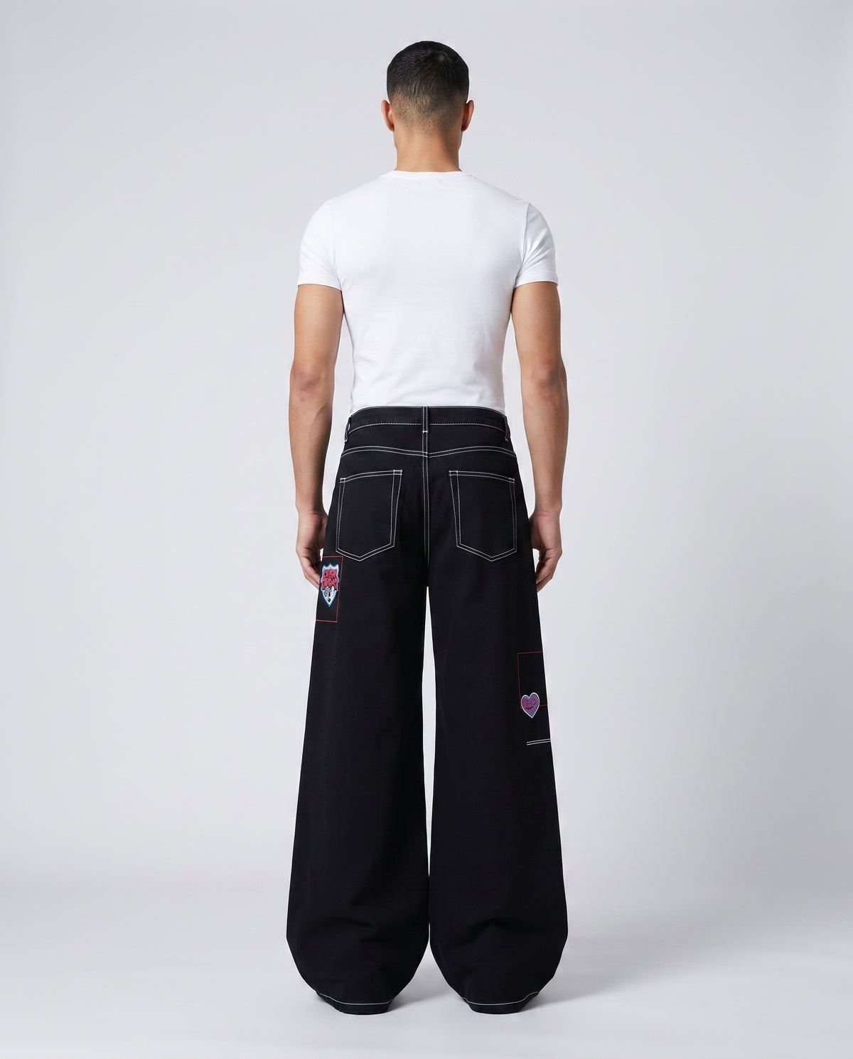Maxout Jeans — Obsidian on model — back view