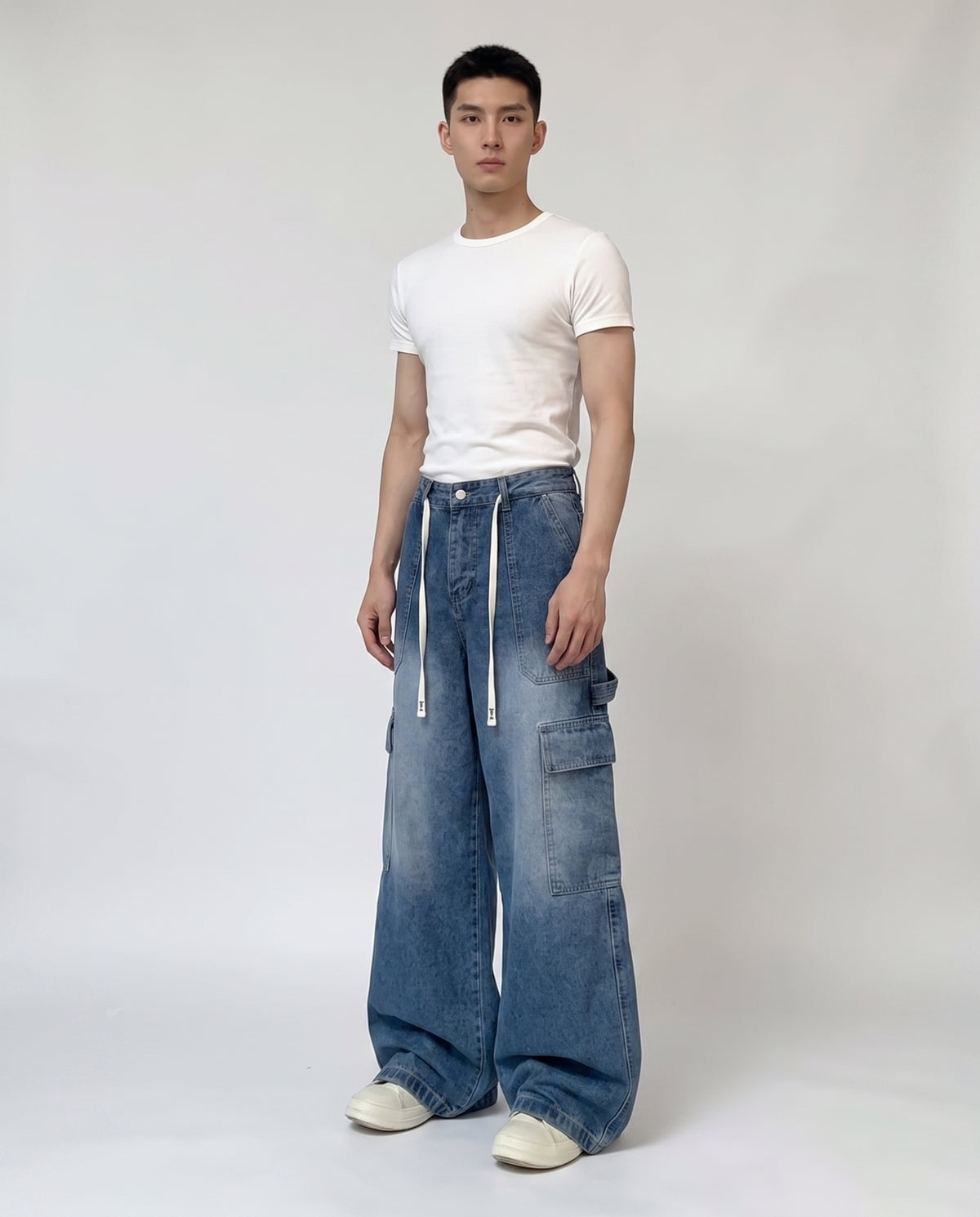 Foreman Jeans — Motor Blue on model — three-quarter view