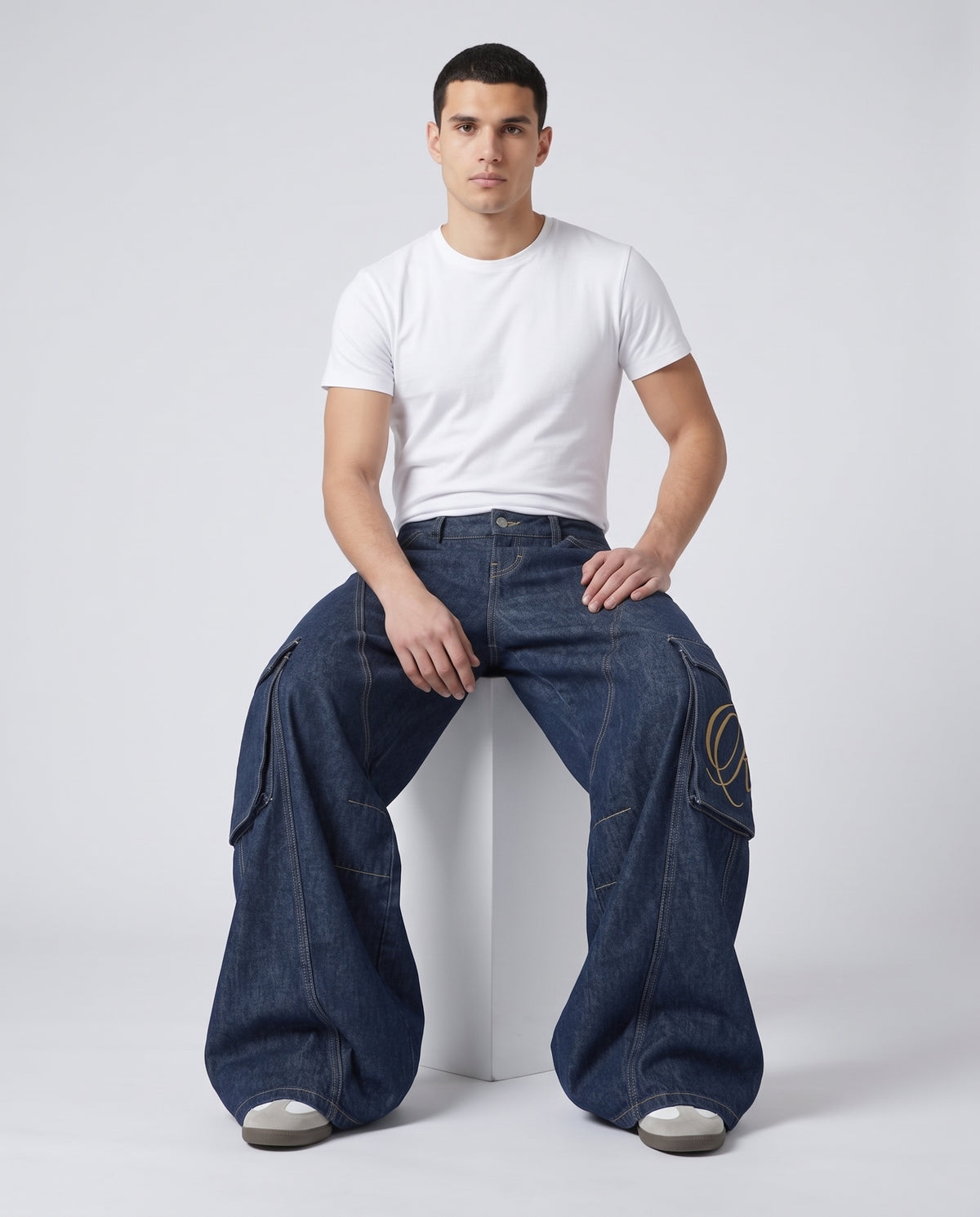Cooper Jeans Lumber Wash on model — seated fit view