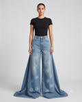 Women's Baggy Jeans Floral Fade on model — mega baggy fit covering shoes