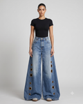 Women's Distressed Baggy Jeans Eyelet Fade on model — mega baggy fit covering shoes
