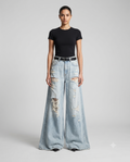 Women's Ripped Baggy Jeans Sun Bleach on model — mega baggy fit covering shoes