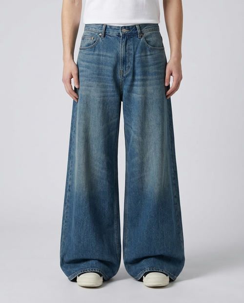 Vintage blue baggy jeans front view — ultra wide leg draping over shoes