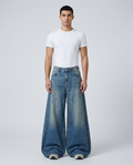 Big Easy baggy jeans in stone wash on model — mega baggy silhouette