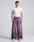 Big Easy baggy jeans in washed purple on model — mega baggy fit covering shoes