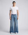 Foreman Carpenter Jeans Retro Wash on model — mega baggy fit covering sneakers