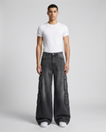 Foreman Carpenter Jeans Street Wash on model — mega baggy fit covering sneakers
