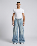 Slack Cargo Jeans Pleated Patchwork on model — mega baggy fit covering sneakers
