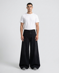 Big Easy Cargo Jeans Night Black on model — mega baggy fit covering sneakers