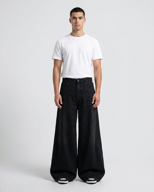 Big Easy Cargo Jeans Night Black on model — mega baggy fit covering sneakers
