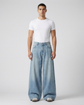 Slack Cargo Jeans Vintage Wash on model — mega baggy fit covering sneakers