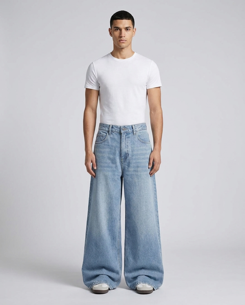 Big Easy Baggy Jeans Sun Bleach on model — mega baggy fit covering sneakers