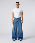 Big Easy Baggy Jeans Classic Blue on model — mega baggy fit covering sneakers