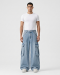 Big Easy Cargo Jeans Pale Wash on model — mega baggy fit covering sneakers