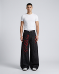Boulevard Embroidered Jeans — Patch Indigo on model — mega baggy fit covering sneakers