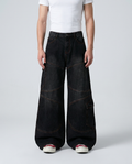 Boulevard Cargo Jeans — Onyx on model — mega baggy fit covering sneakers