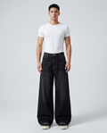 Slack Jeans — Blacktop on model — mega baggy fit covering sneakers