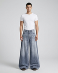 Slack Jeans — Chalk Wash on model — mega baggy fit covering sneakers