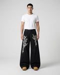 Slack Jeans — Rodeo Night on model — mega baggy fit covering sneakers