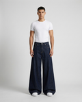Cooper Jeans Night Wash on model — mega baggy fit covering sneakers