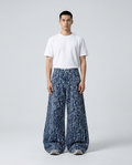 Maxout Jeans Midnight Stripe on model — mega baggy fit covering sneakers
