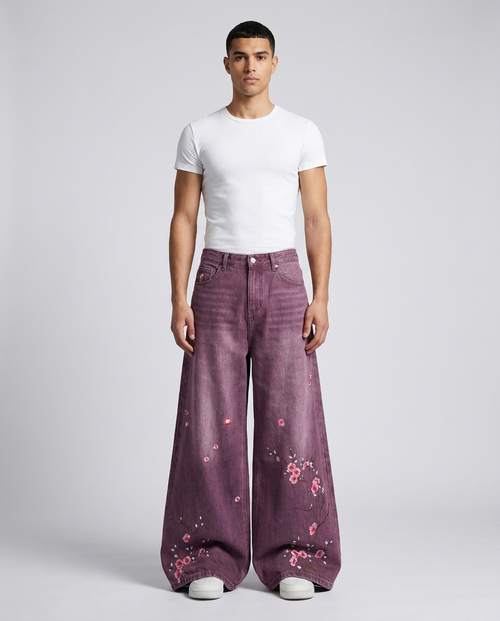 Big Easy Embroidered Jeans Plum Wash on model — mega baggy fit covering sneakers