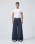 Easy Jeans Wave Stripe on model — mega baggy fit covering sneakers