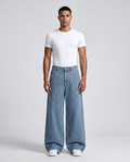 Easy Jeans Shore Stripe on model — mega baggy fit covering sneakers
