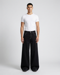 Maxout Jeans Jet Black on model — mega baggy fit covering sneakers