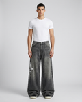 Maxout Jeans Skull Smoke on model — mega baggy fit covering sneakers