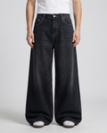 Big Easy Jeans Patchwork Night on model — mega baggy fit covering sneakers