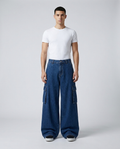 Big Easy Cargo Jeans Night Shift on model — mega baggy fit covering sneakers
