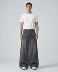 Easy Jeans Ash Grey on model — mega baggy fit covering sneakers