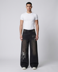 Big Easy Jeans Shadow Black on model — mega baggy fit covering sneakers