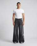 Easy Jeans Comic Night on model — mega baggy fit covering sneakers