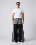 Easy Jeans Cinder Patch on model — mega baggy fit covering sneakers