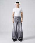 Maxout Jeans Polar White on model — mega baggy fit covering sneakers